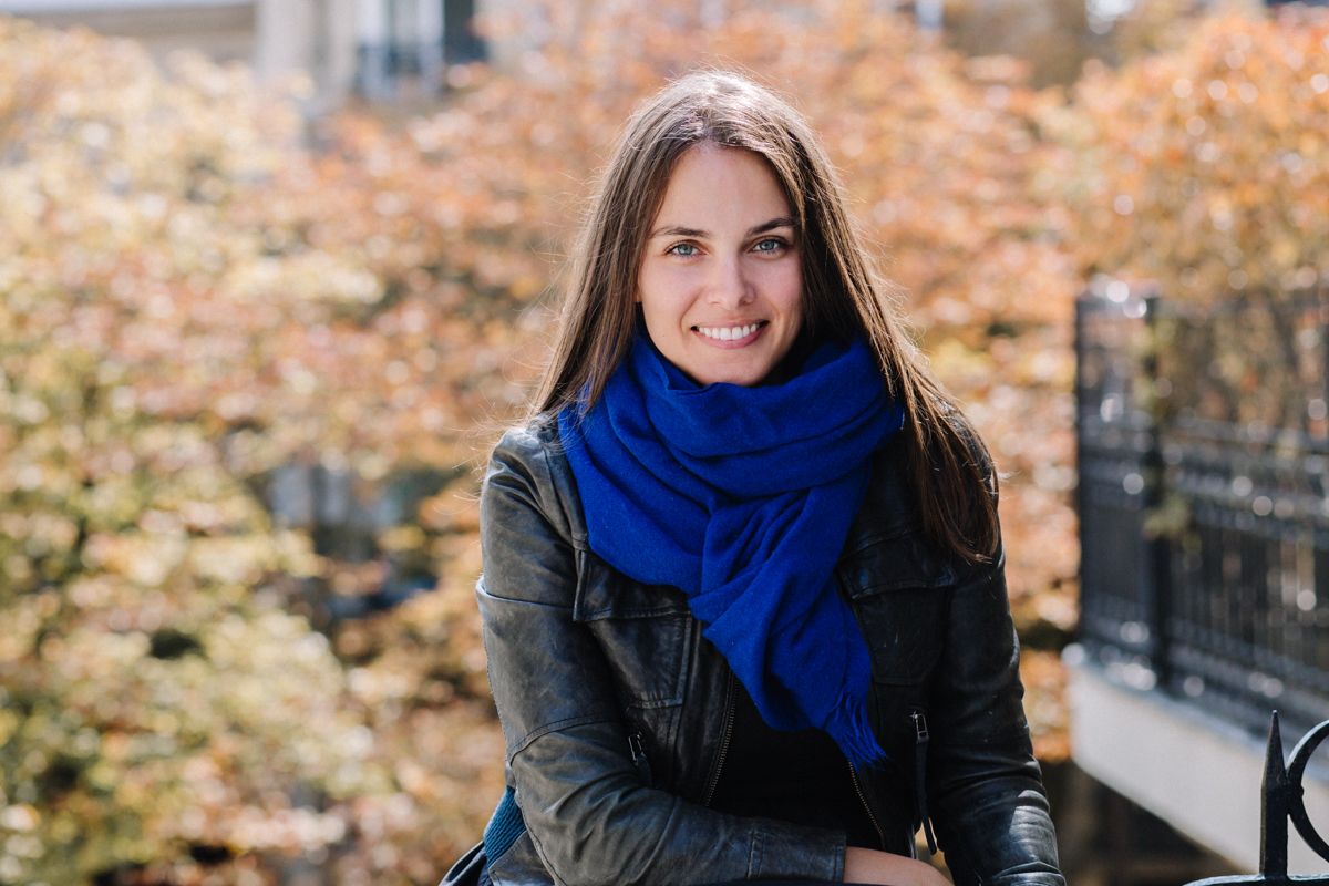 Yasmine smiling with a autumn background